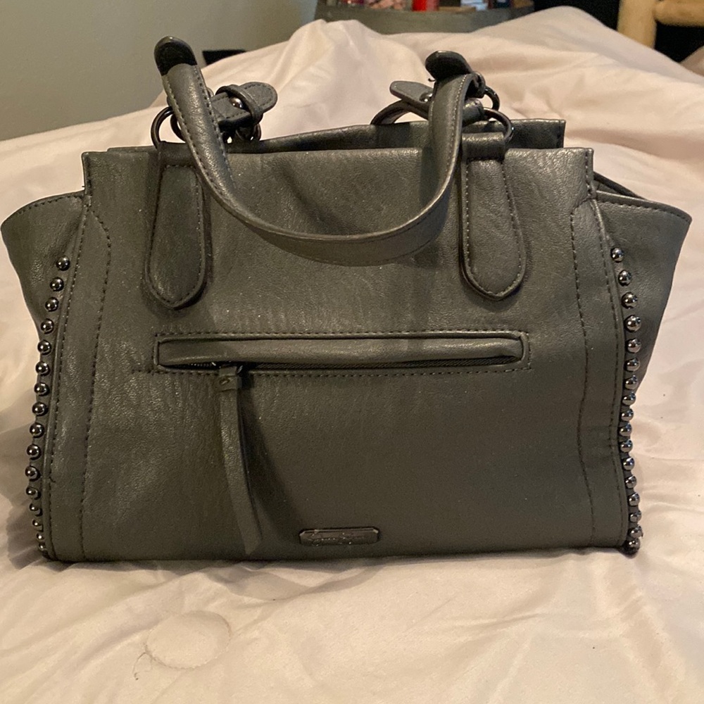Jessica Simpson charcoal gray pocketbook with cheetah print inside.